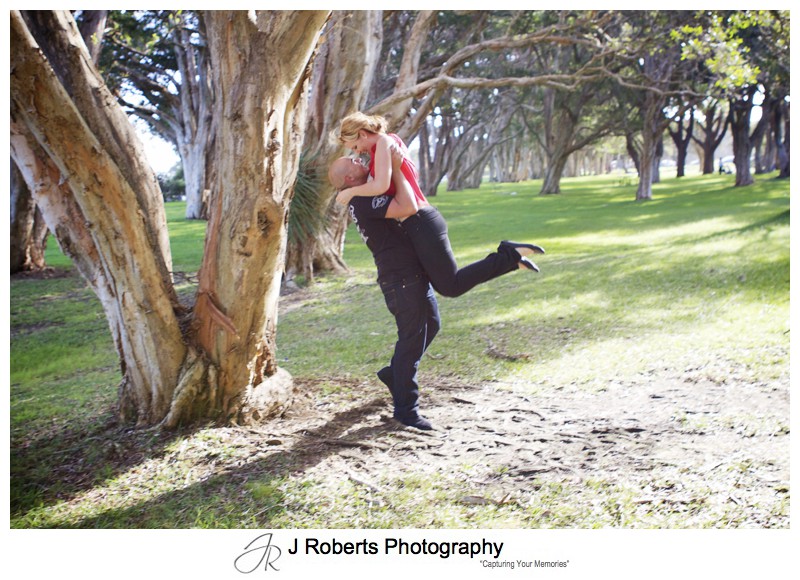 Couple having fun embracing and dancing centennial park - couple portrait photography - sydney