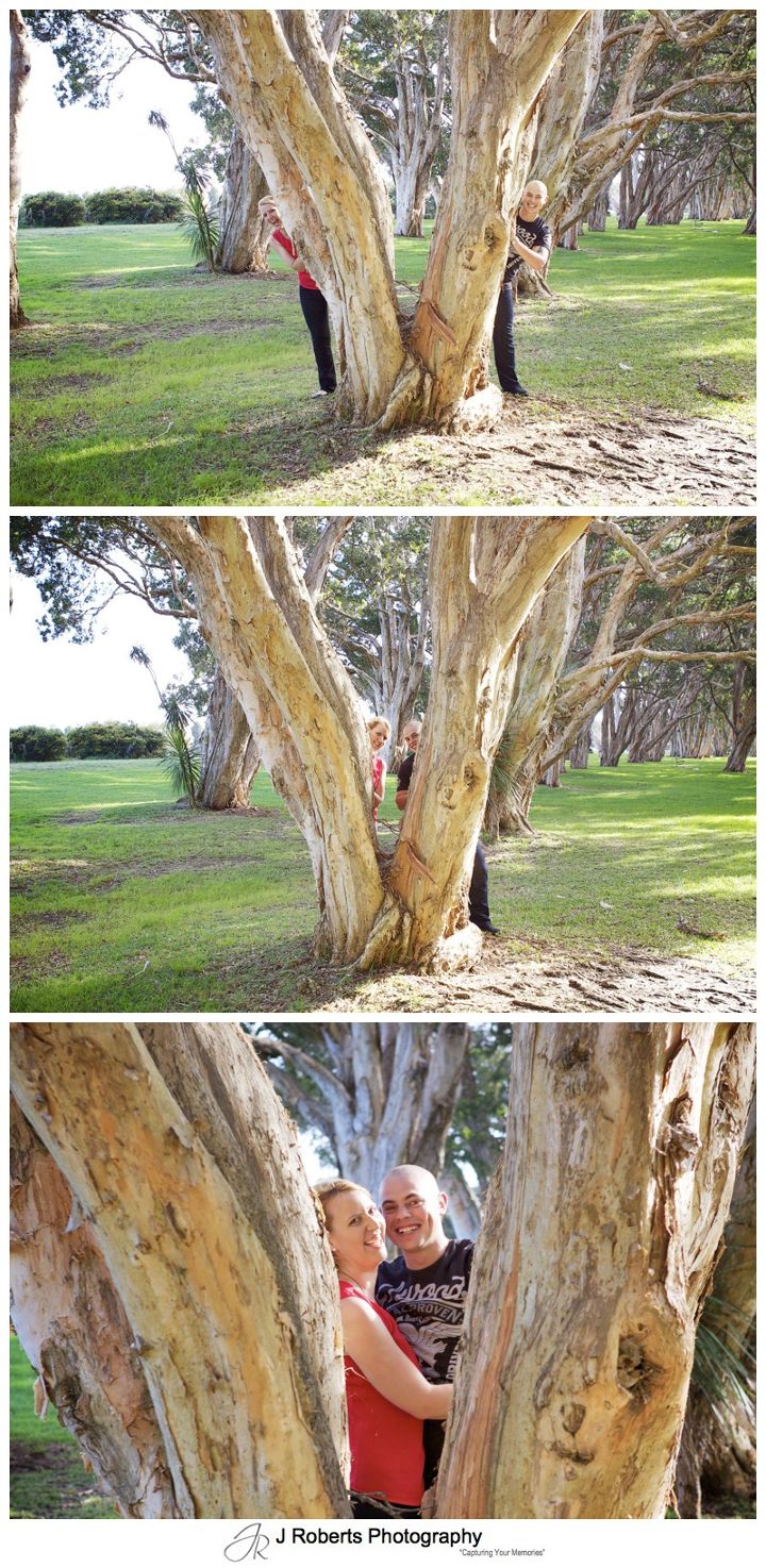 romantic couple hiding in the trees centennial park - couple portrait photography - sydney