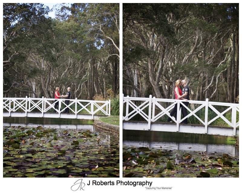 couple kissing on a bridge over lake in centennial park - couple portrait photography - sydney