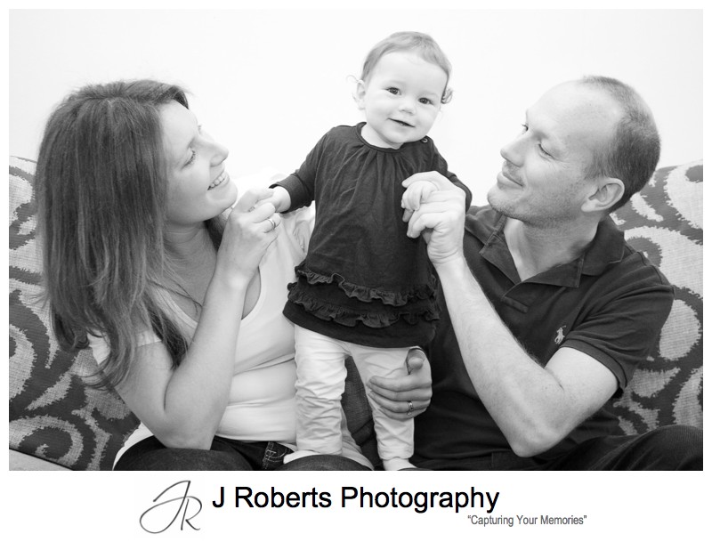 Cheeky little girl with family portraits - family portrait photography balmain
