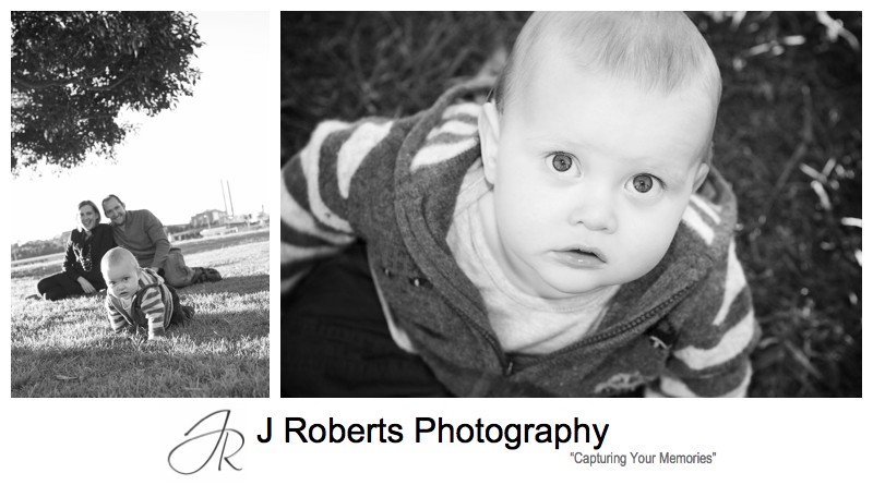 B&W portrait of a little boy looking up at the camera - family portrait photography sydney