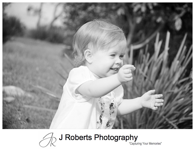 Little toddler chasing bubbles - family portrait photography sydney