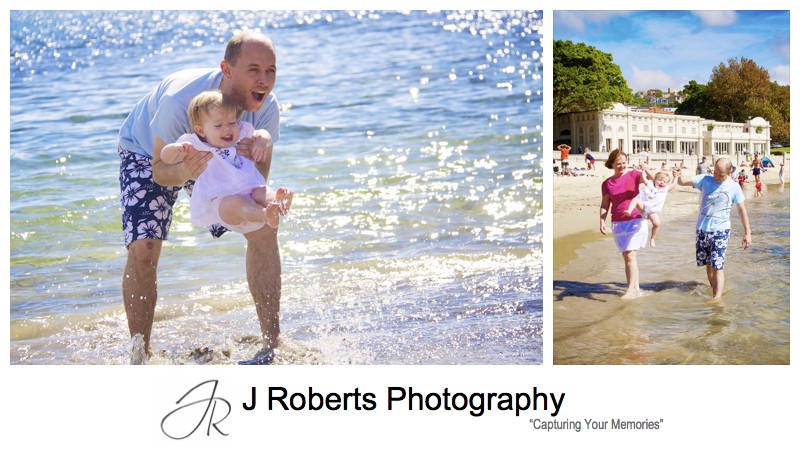 Little girl splashing in the water on balmoral beach - family portrait photography sydney