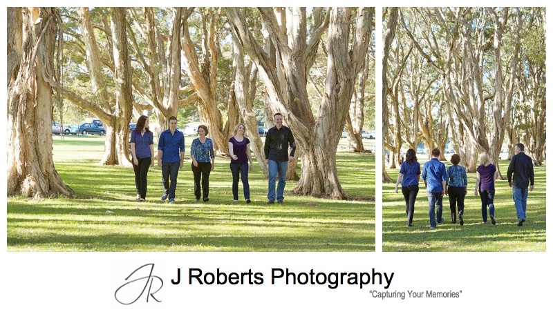 Family walking through the paperbark grove at Centennial Park - family portrait photography sydney