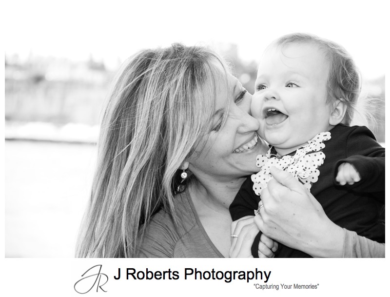 B&W portrait of mother and baby girl laughing - family portraits sydney