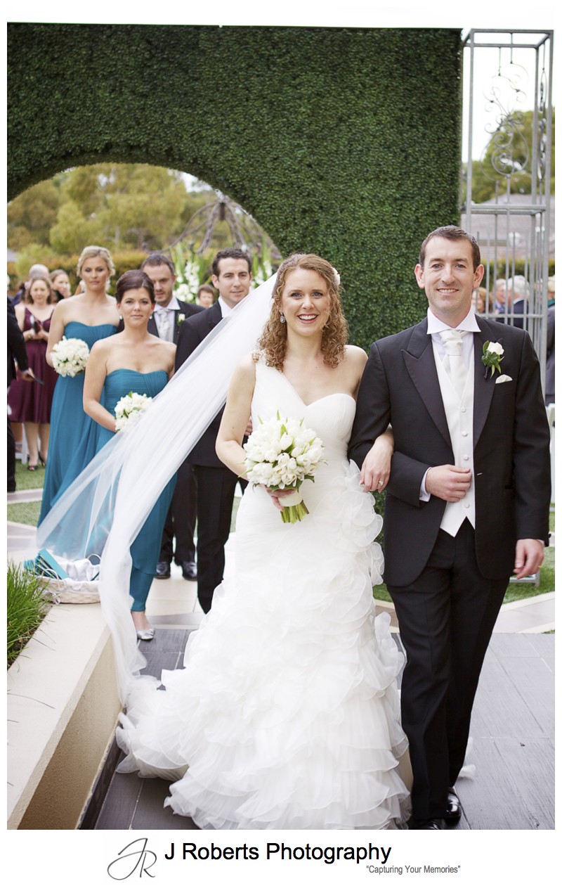 Bride and groom walk down the aisle as the married couple = wedding photography sydney