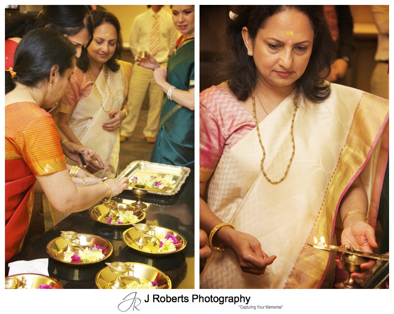 Flowers and oil burning details of Hindu Marriage Blessing - wedding photography sydney