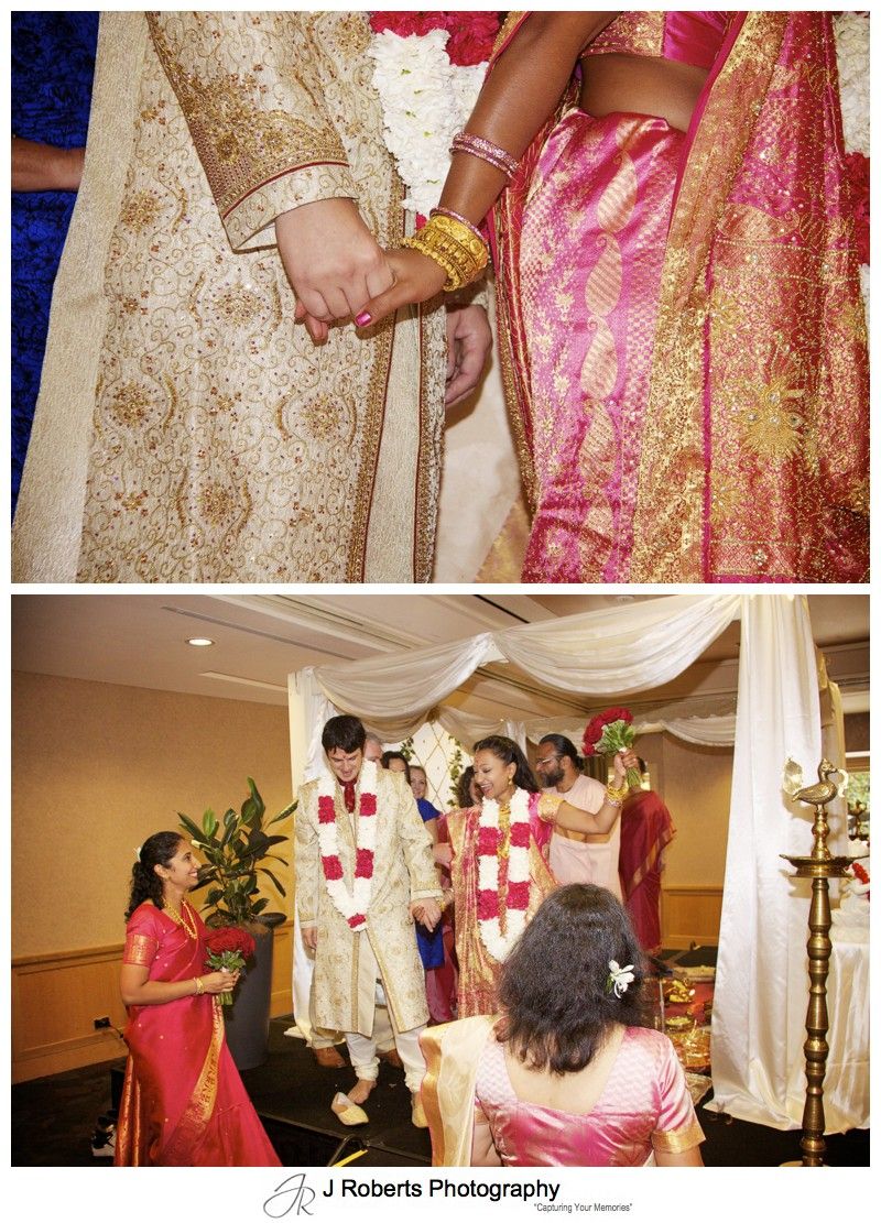 Bride and groom celebrating their hindu marriage blessing - wedding photography sydney