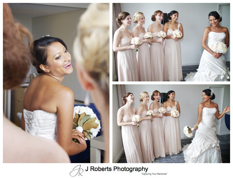 Bride laughing with bridesmaids in neutral colour dresses - wedding photography sydney
