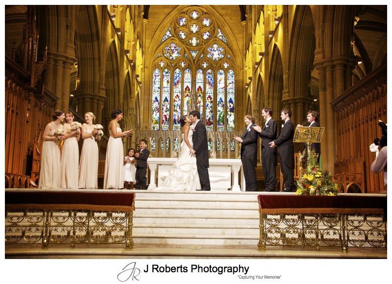 Bride and grooms kiss st Mary's Cathedral Sydney - wedding photography sydney