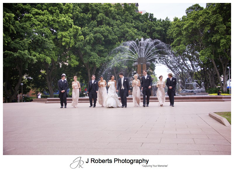 Bridal party walking through Hyde Park Sydney - wedding photography sydney