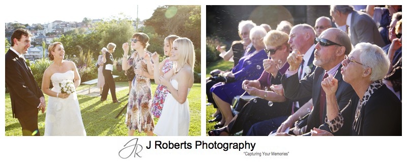 Blowing bubbles in celebration of marriage - wedding photography sydney