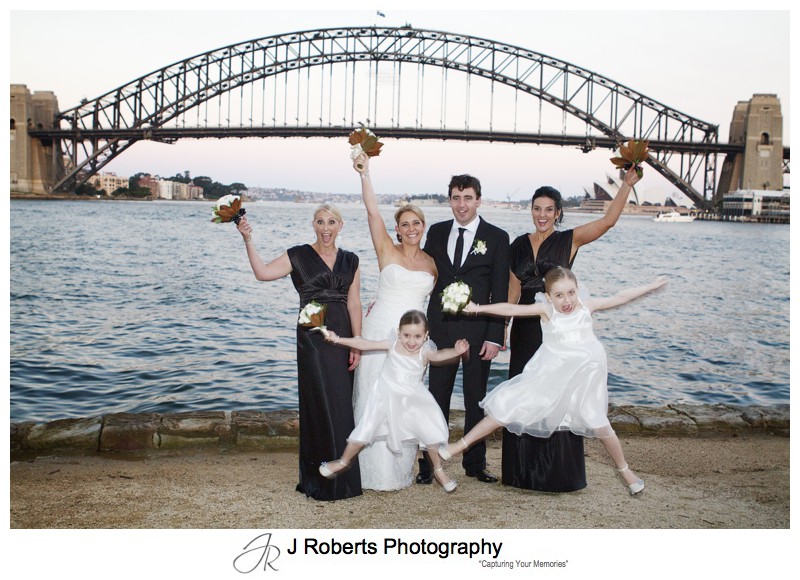 Jumping flower girls with bridal party on Blues Point -wedding photography sydney