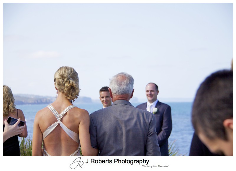 Bride walking down the aisle to the groom - wedding photography sydney