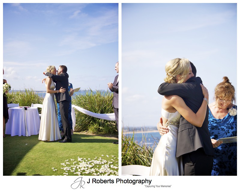 Couples first kiss and embrace as a married couple - wedding photography sydney