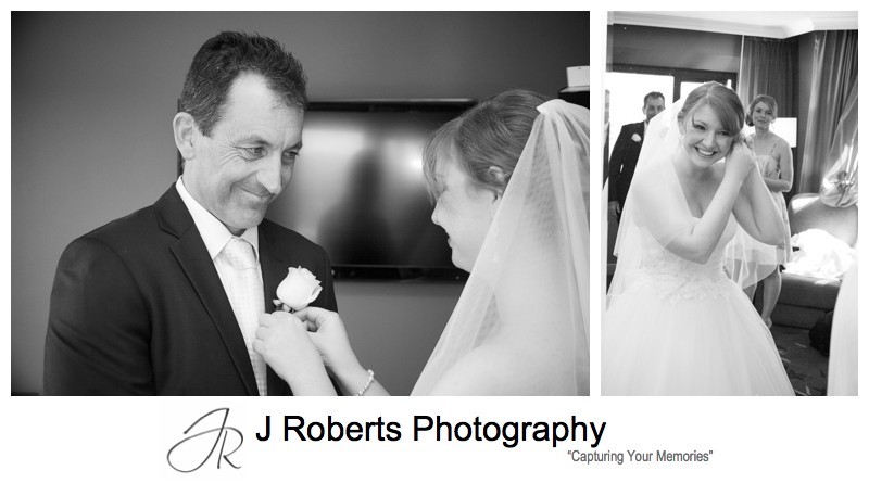 Bride putting button hole on father - wedding photography sydney