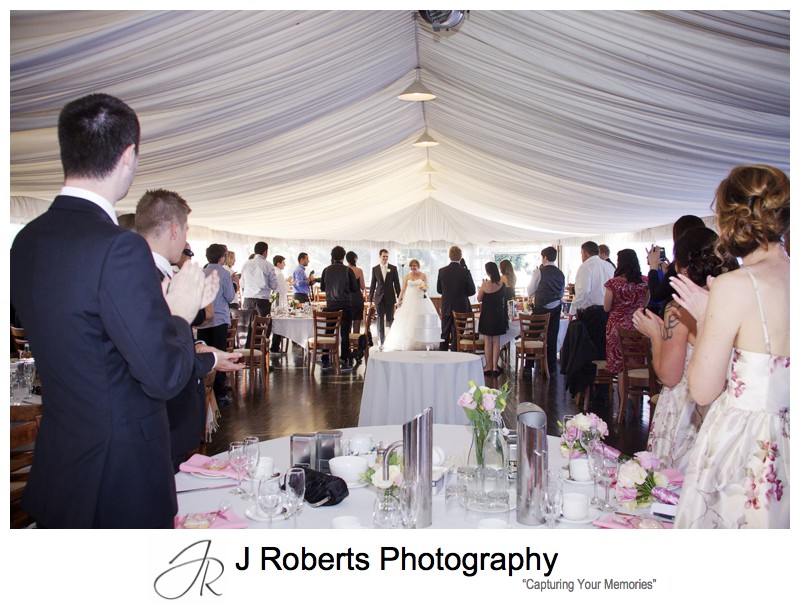Bride and grooms arrival at high tea reception in the marquee at old government house parramatta - wedding photography sydney