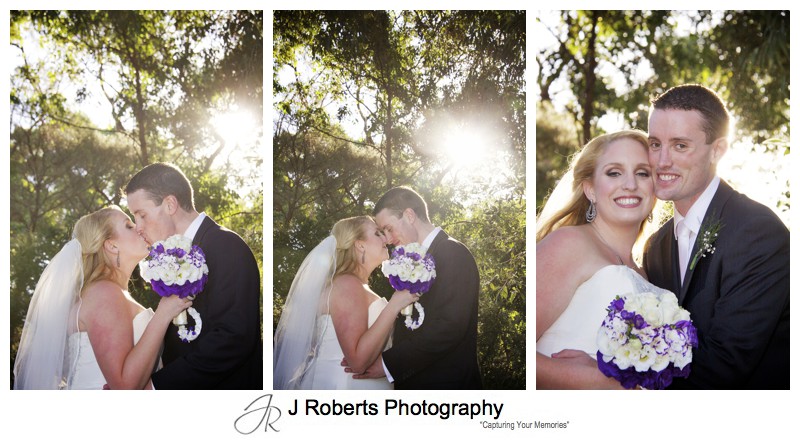 Bride and groom with setting sun through gum trees - wedding photography sydney