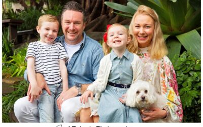 Family portrait fun in the rain in Sydney gumboots and umbrellas Wendy Whiteleys Garden Lavender Bay